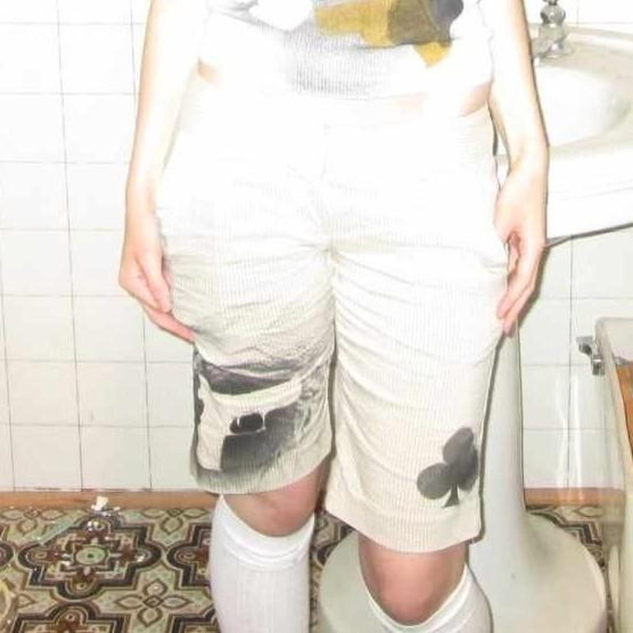 cream striped symbol shorts