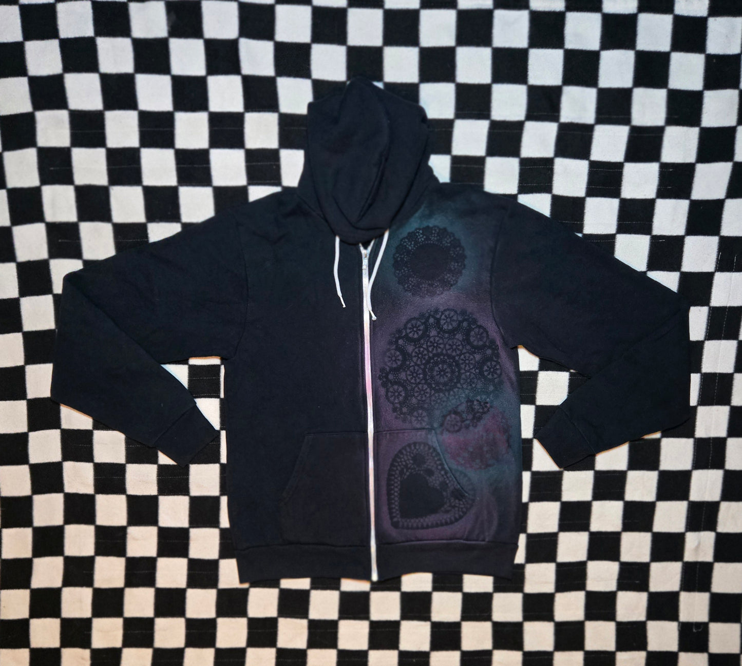 black, pink, and blue doily jacket